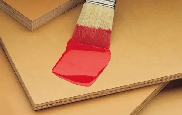 a paintbrush with red paint dripping from a paintbrush